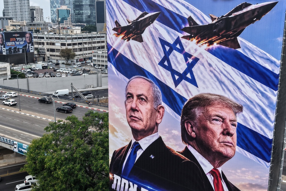 A campaign banner shows Netanyahu and Trump in Tel Aviv on Monday (AFP/Getty)