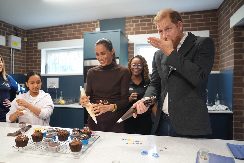 Meghan with her husband Prince Harry at their first public outing, in Nottingham after moving back to the UK (PA)