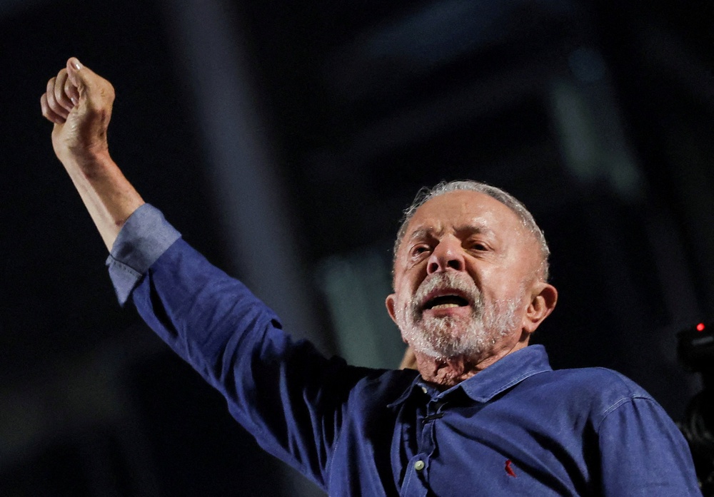 Brazil's President Luiz Inacio Lula da Silva, the Workers' Party (PT) gestures as he addresses supporters after his victory in the presidential runoff election (Reuters)