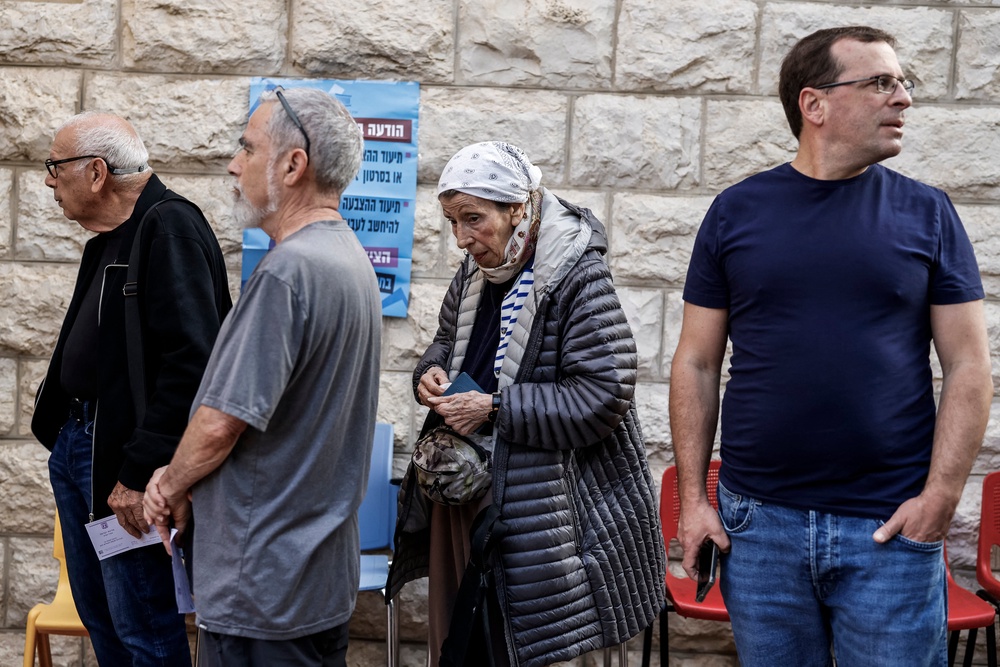 Voters wait in a queue to cast their ballots at a polling station in Jerusalem (AFP/Getty)