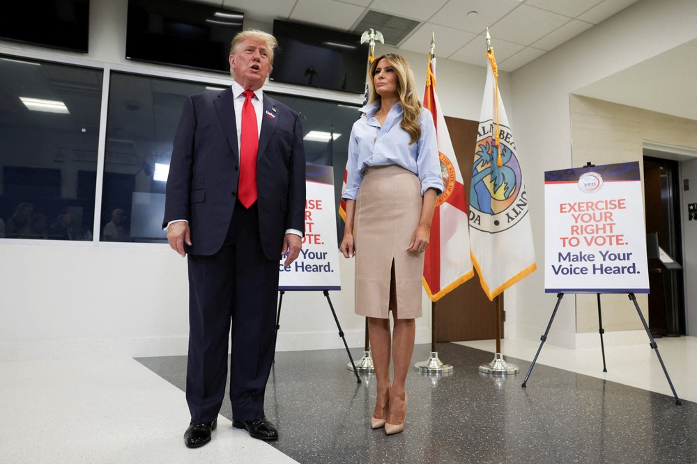 President Donald Trump speaks next to first lady Melania Trump after casting his ballot at the Palm Beach County Supervisor of Elections office, in the 2026 midterm elections in West Palm Beach, Florida, US, October 24, 2026 (Reuters)