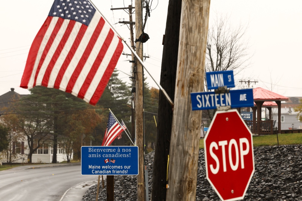 A sign welcoming Canadian people is seen near the US-Canada border in Madawaska, Maine (AFP/Getty)