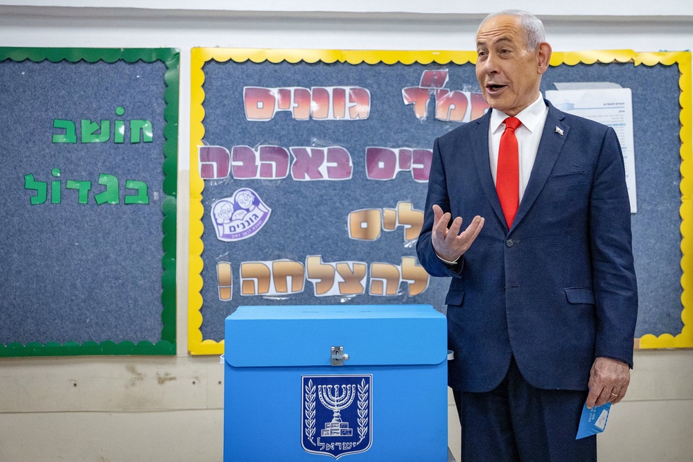 Benjamin Netanyahu turns out to vote at a polling station in Jerusalem on Tuesday (Reuters)