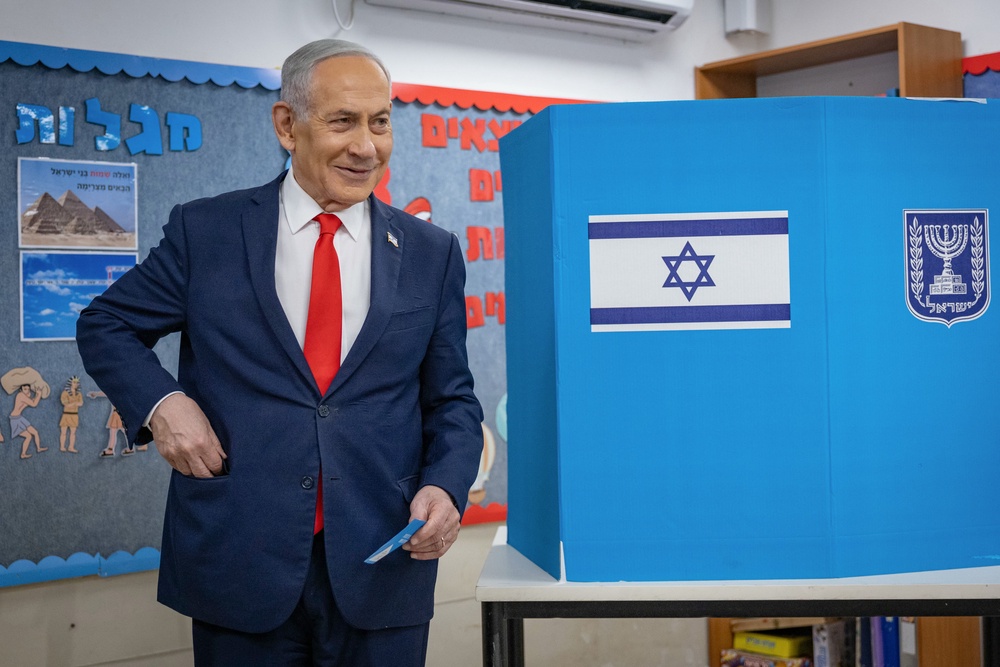 Benjamin Netanyahu turns out to vote at a polling station in Jerusalem on Tuesday (AP)
