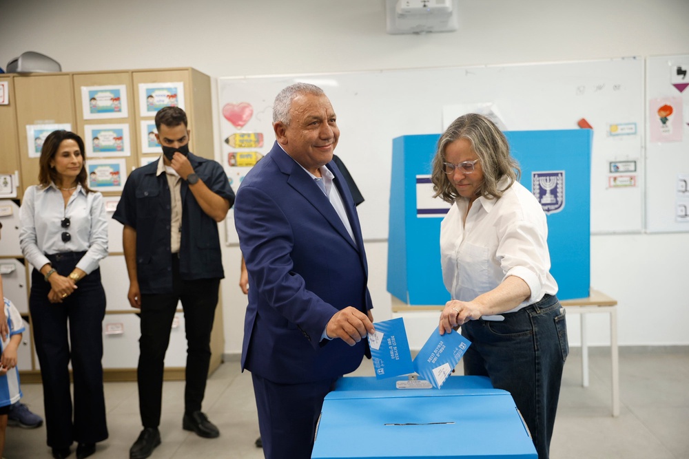 Yashar Party leader, Gadi Eisenkot, casts his vote alongside his wife Hannah at a polling station in Herzliya on October 27 (Getty)