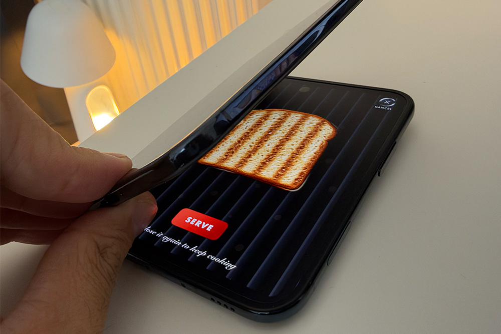 Checking in to see if my cheese toastie is ready to serve (Alex Lee/The Independent)