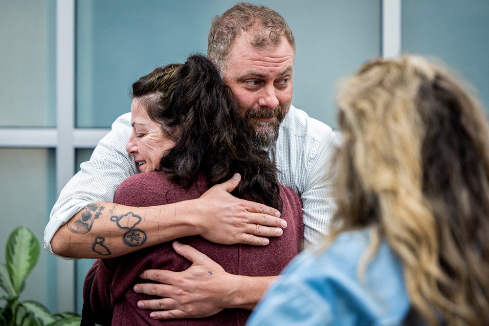 Utah County Sheriff's Deputy Jake Hall hugs Tommi Aime, the youngest sister of Laura Ann Aime, after announcing that definitive evidence linked Ted Bundy to Laura's murder (The Deseret News)