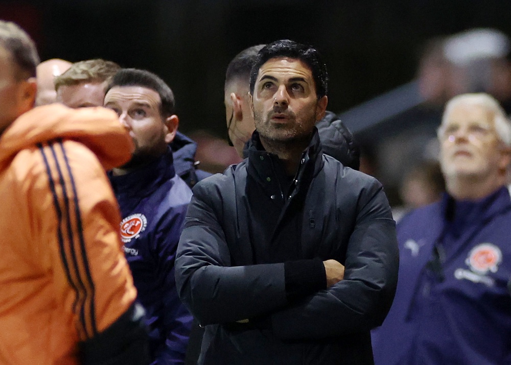 Mikel Arteta, Manager of Arsenal, looks on as a drone pauses the game (Getty)