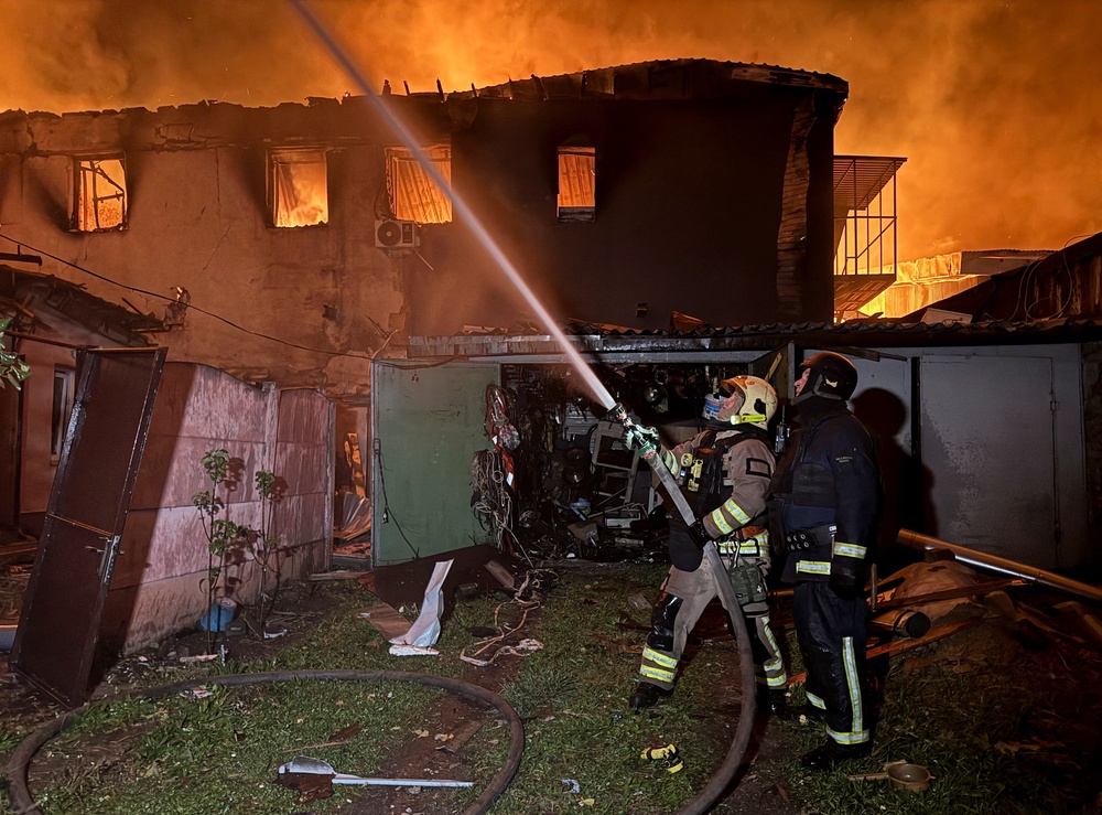 Firefighters work at the site of a Russian drone strike, amid Russia's attack on Ukraine, in Kharkiv (Reuters)