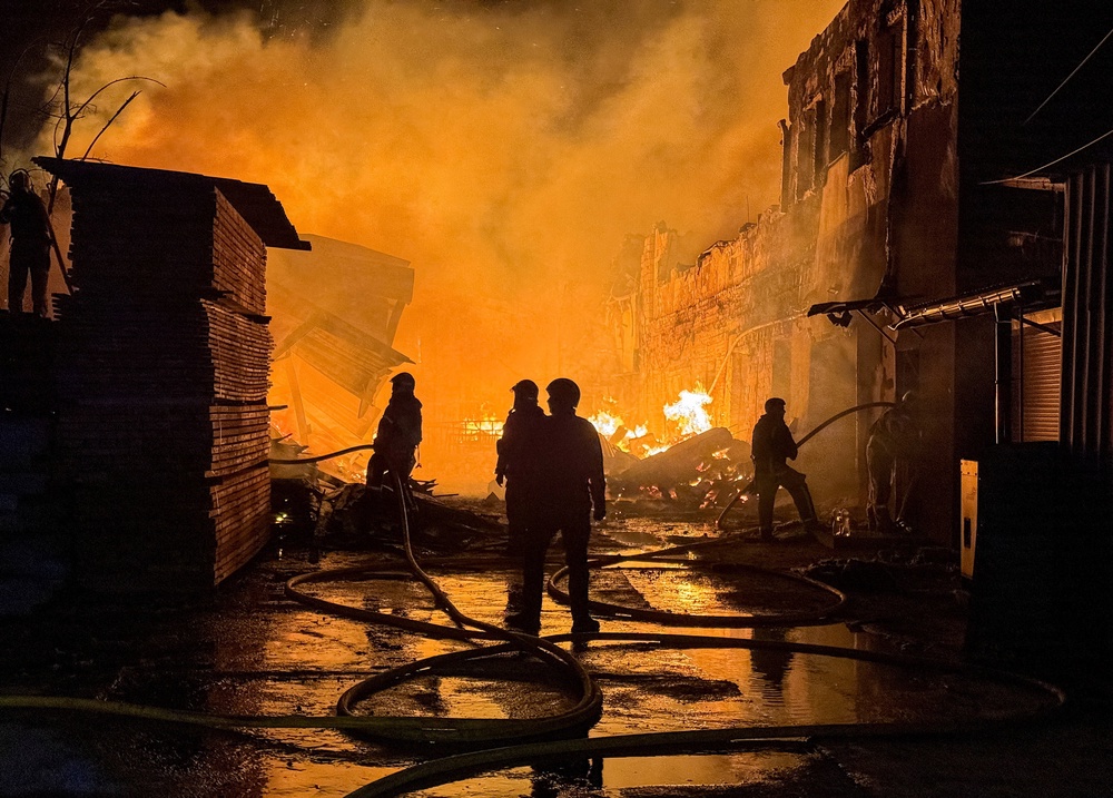 Firefighters work at the site of a Russian drone strike, amid Russia's attack on Ukraine, in Kharkiv (Reuters)