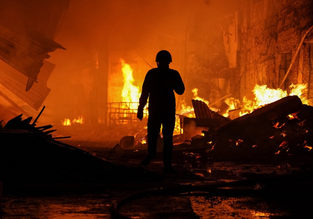 A rescuer stands at a site of a Russian drone strike, amid Russia's attack on Ukraine, in Kharkiv, Ukraine October 28, 2026 (Reuters)