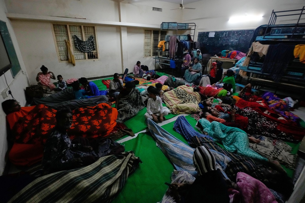 People gather at a temporary shelter set up inside a school as Cyclone Arnab approaches the Andhra Pradesh (AP)