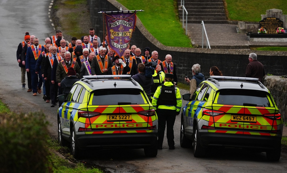 Orangemen make their way from Drumcree Church as police form a barricade to prevent them entering the Garvaghy Road. (PA) (PA Wire)