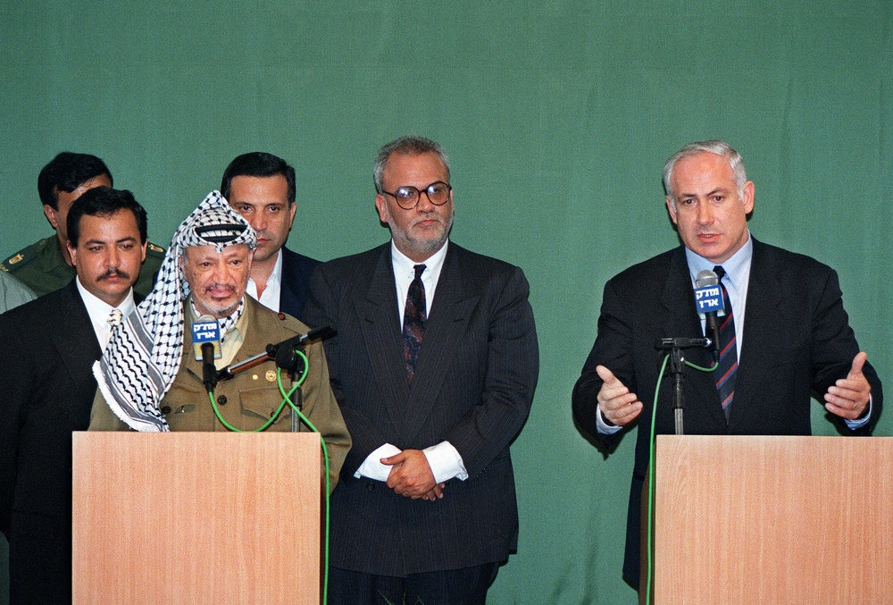 The Israeli prime minister with the late Palestinian President Yasser Arafat (L) in September 1996 (AFP/Getty)