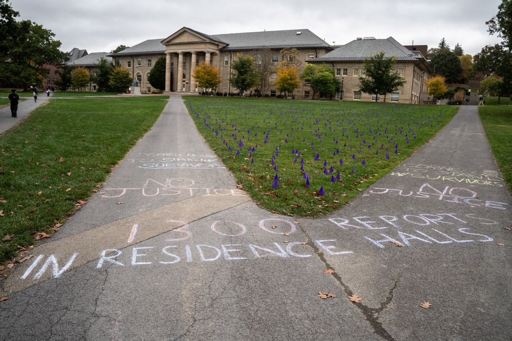 Chalk messages reading ‘1300 reports in residence halls’ and ‘No Justice’ are written on a sidewalk at the Ag Quad in Ithaca, New York, US, October 14, 2026 (Reuters)