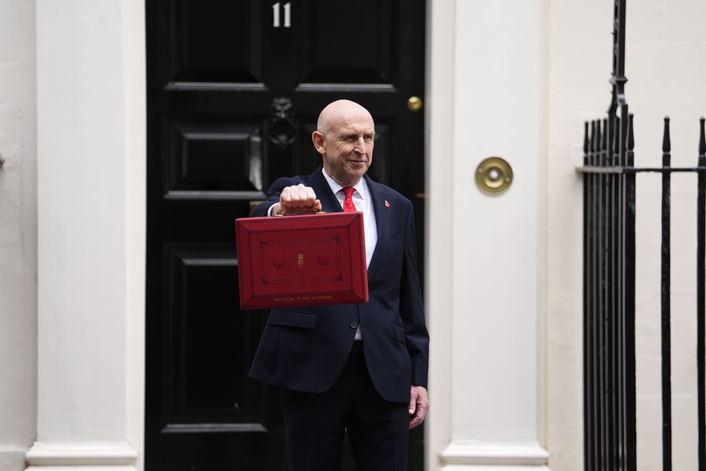Chancellor of the Exchequer John Healey poses for photographs as he leaves 11 Downing Street before delivering his first Budget (Jordan Pettitt/PA) (PA Wire)