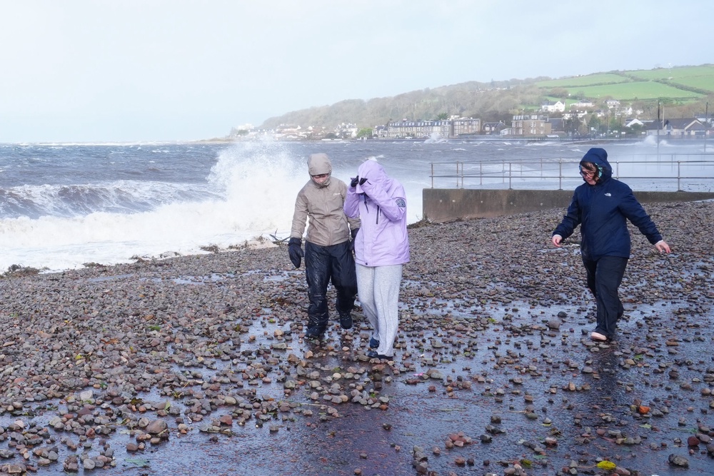 People walking along the sea front at Largs after Storm Boelo passed through (Jane Barlow/PA) (PA Wire)