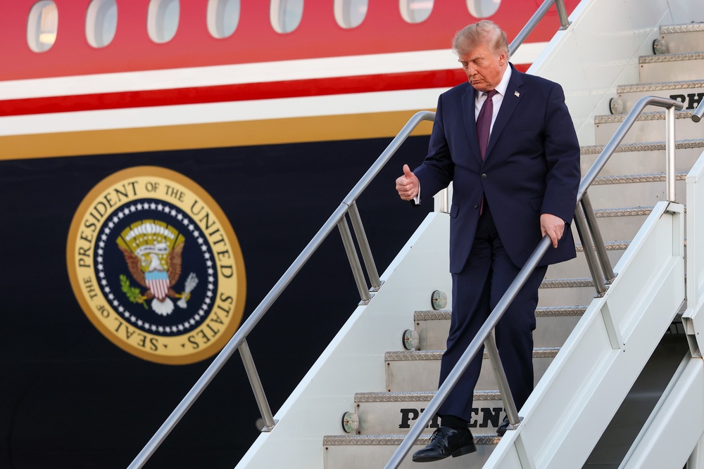 Donald Trump steps off the plane after landing on Air Force One at Rickenbacker International Airport (Getty)