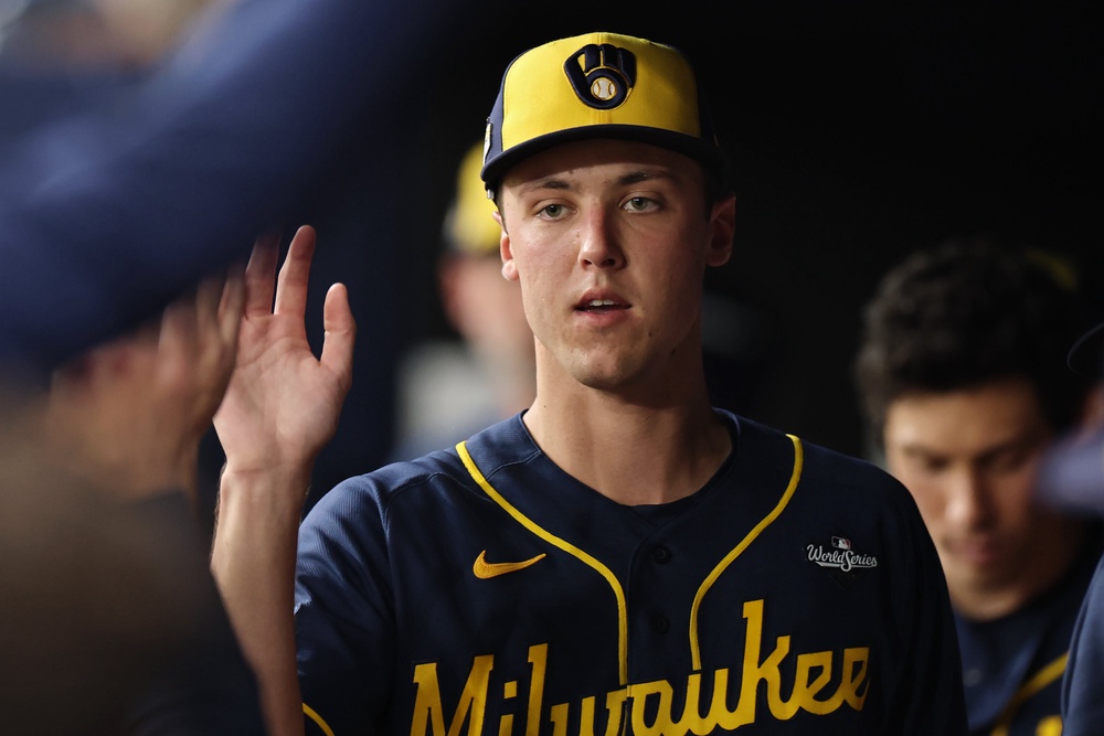 Jacob Misiorowski #32 of the Milwaukee Brewers interacts with teammates in the dugout (Getty)