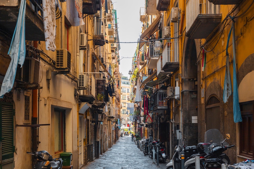 Washing strung between tall tenement buildings in the Spanish Quarter in Naples (Getty/iStock)
