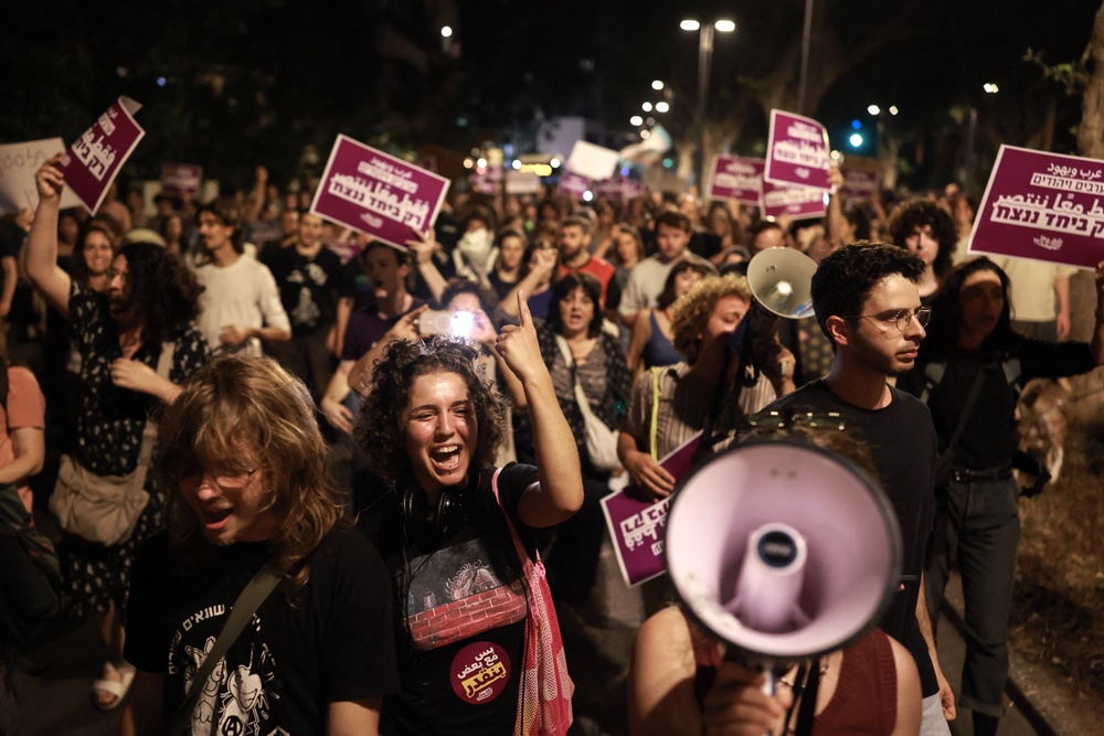 Israeli left-wing activists hold placards and chant slogans during a demonstration calling for a formation of a government in Tel Aviv on Wednesday (AFP/Getty)