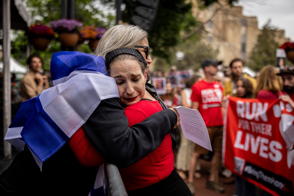 Rachel Amaru, an organizer for Run for Their Lives, embraces Rachel Cohen after the June 1 attack in Boulder (Getty)