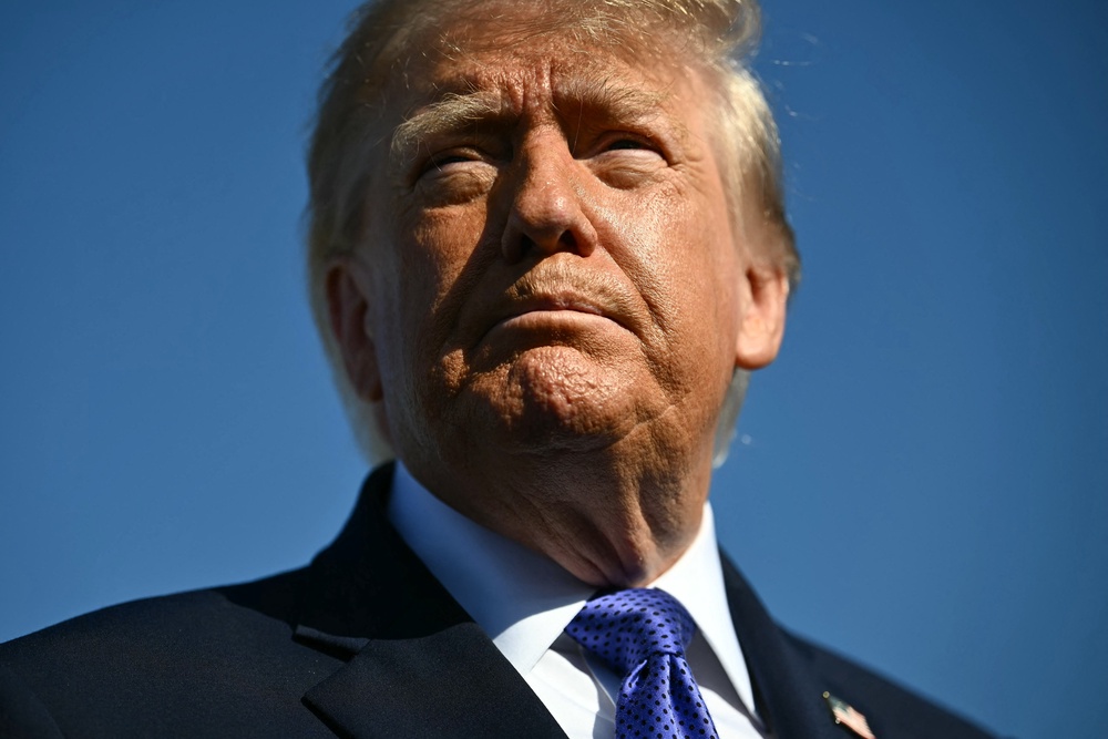 Trump keeps insisting that the midterms will go well if people ‘pretend he’s on the ballot.’ But he’s gotten into a verbal tussle with Obama about dinner plans (AFP/Getty)