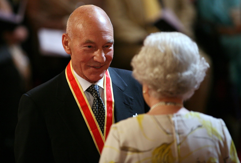 Hollywood actor Sir Patrick Stewart is knighted by Queen Elizabeth II during investitures at Buckingham Palace in 2010 (Anthony Devlin/PA) (PA Archive)