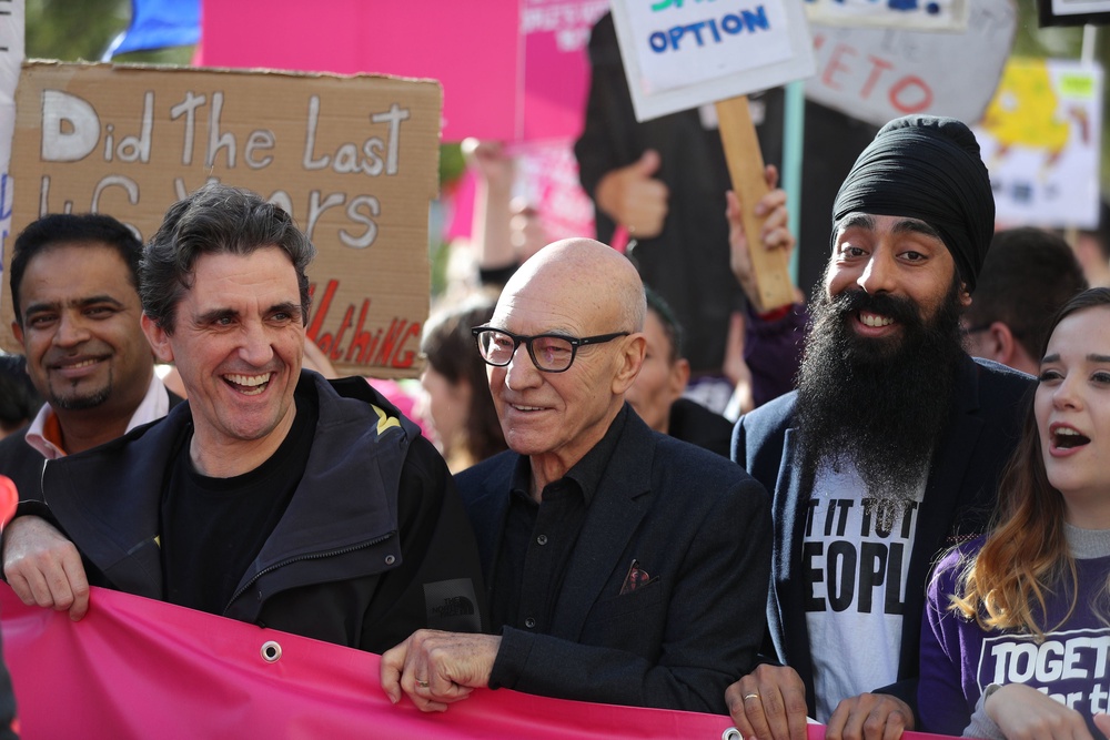 Sir Patrick Stewart (centre) and Stephen McGann (centre left) join protesters in an anti-Brexit, Let Us Be Heard march in Old Park Lane as they head to Parliament Square in 2019 (Andrew Matthews/PA) (PA Archive)