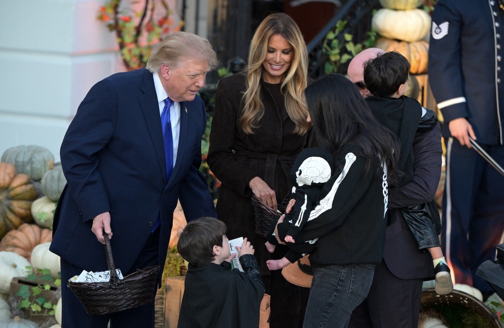 Miller's children receive candy from the Trumps (AFP via Getty Images)