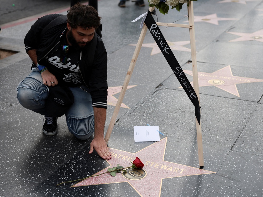 A person visits the Hollywood Walk of Fame star of the late actor Patrick Stewart in Los Angeles, California (Reuters)