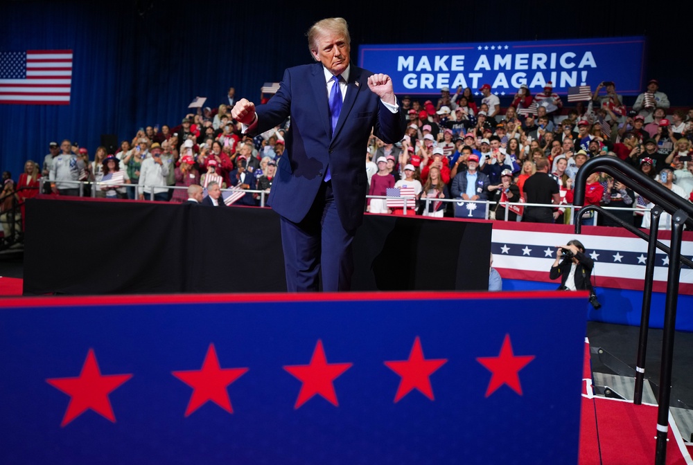 President Donald Trump has reversed course and will now hold midterm rallies in Kansas and Iowa this weekend after he was called out by a reporter for canceling them, according to reports (Getty)