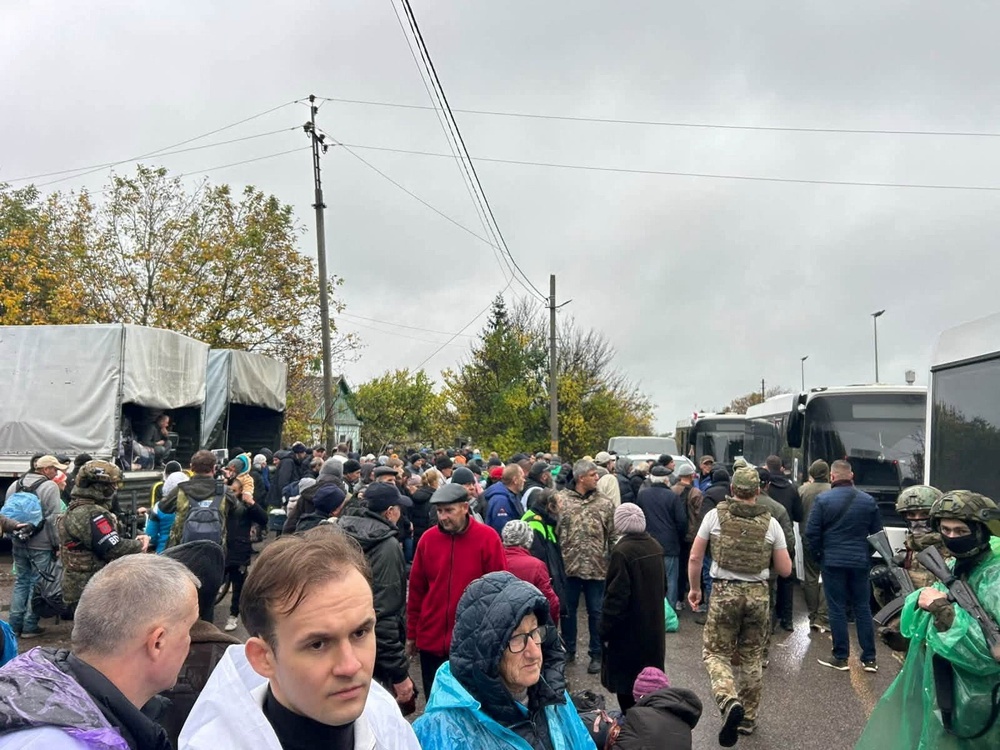 Residents during the evacuation of Oleshky on Friday (Reuters)