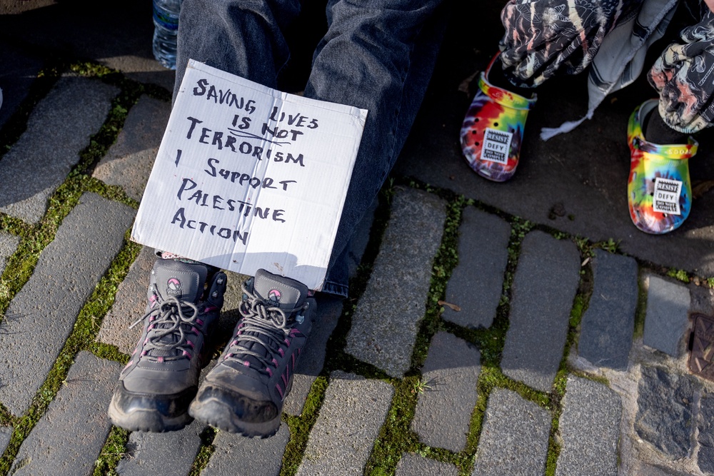 Campaigners held placards outside the US Consulate (Jane Barlow/PA) (PA Wire)