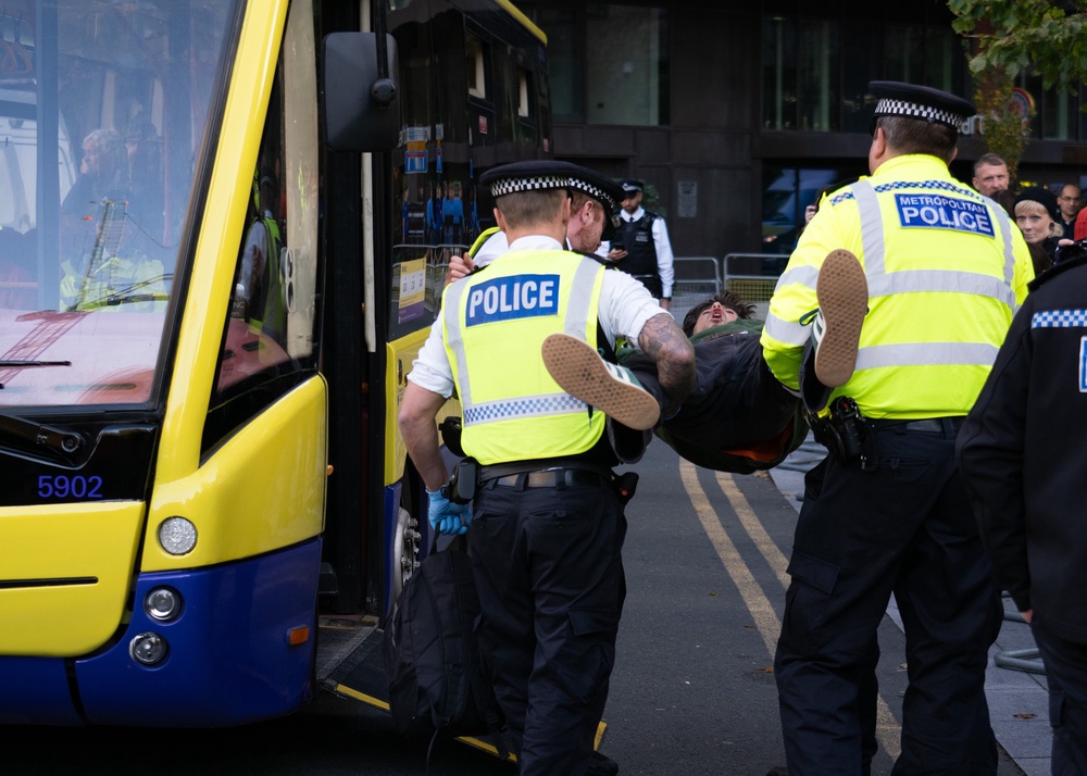 Some protesters were taken away to police vans (Marcin Calak/PA) (PA Wire)