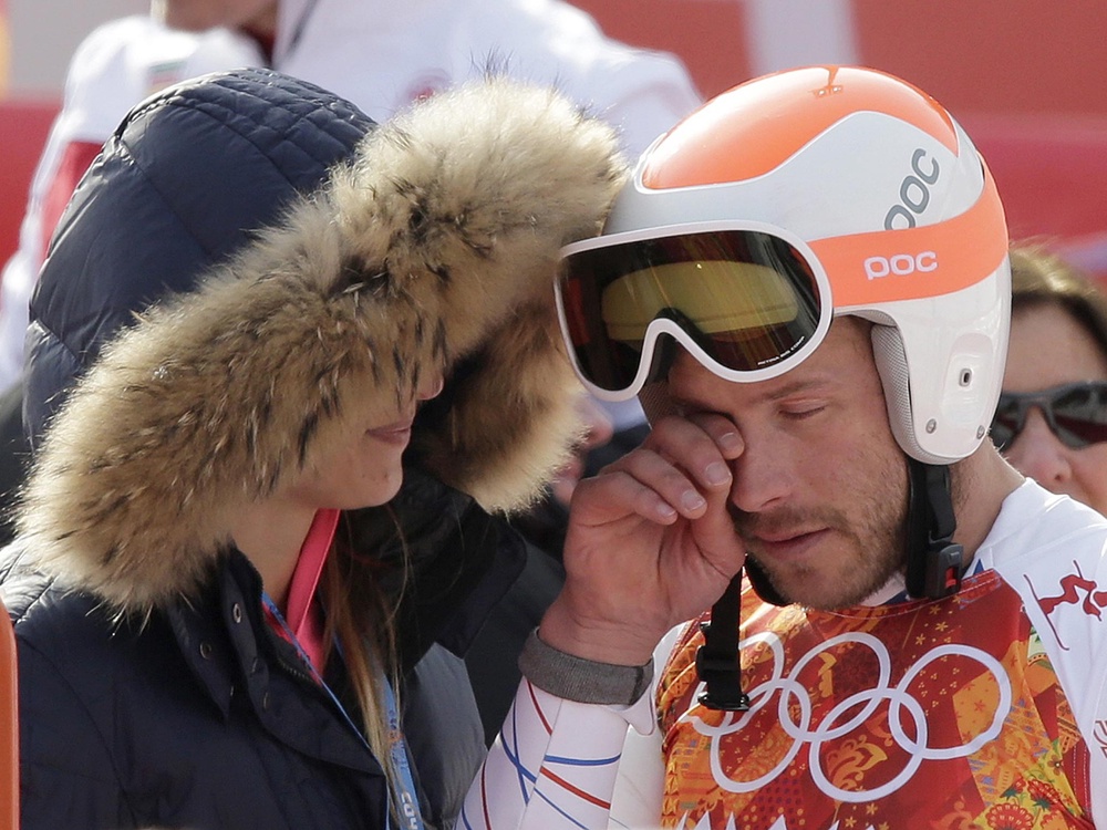 Miller is consoled by his wife after securing a share of bronze in the men’s Super-G in 2020 (AP)