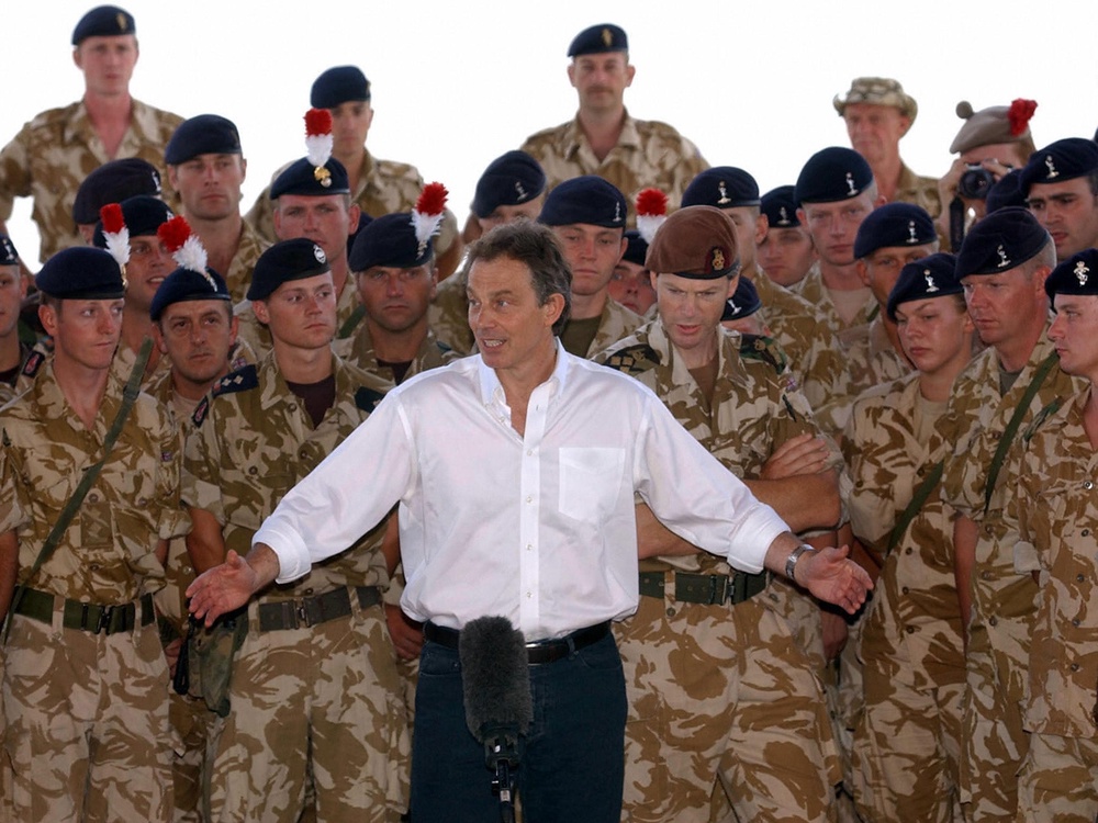 Tony Blair addressing troops in Basra, Iraq in May 2003 after the invasion. He has denied claims he wanted to invade the country as early as November 2001 (AFP/Getty)
