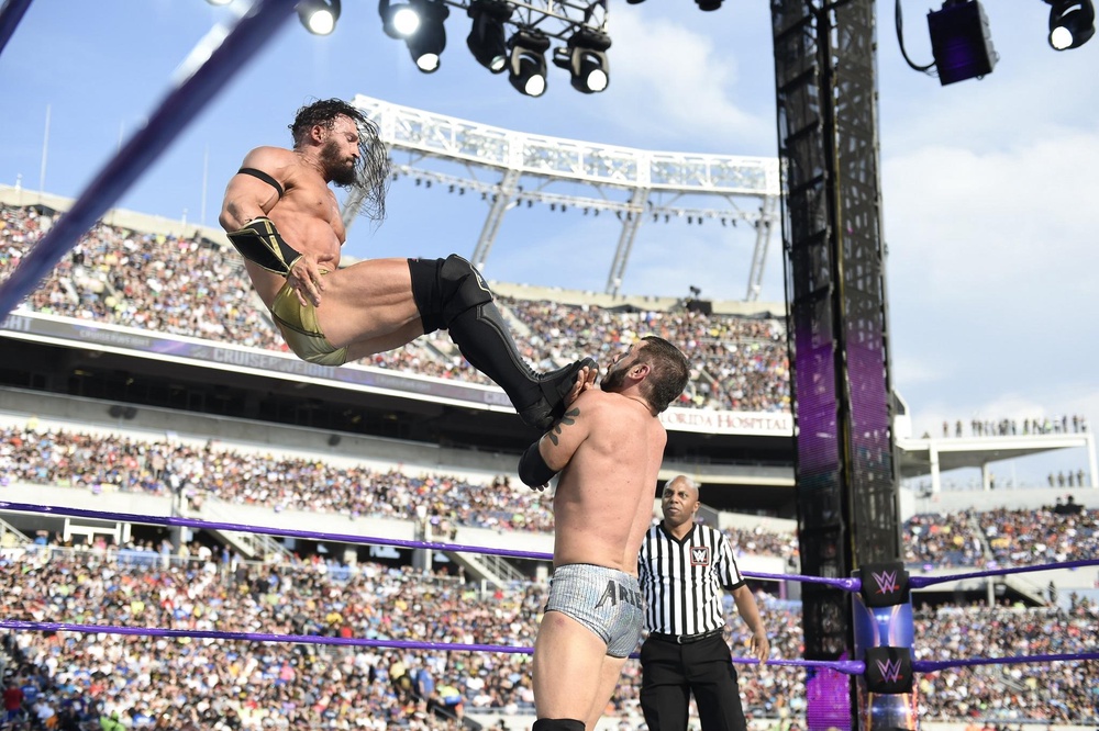 Pac/Neville delivers a dropkick to Austin Aries at WrestleMania 33 (WWE/Craig Melvin/2017)