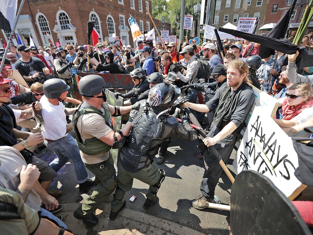 File. White nationalists, neo-Nazis and members of the alt-right clash with counter-protesters as they enter Lee Park during the Unite the Right rally 12 August 2017 in Charlottesville, Virginia (Getty)