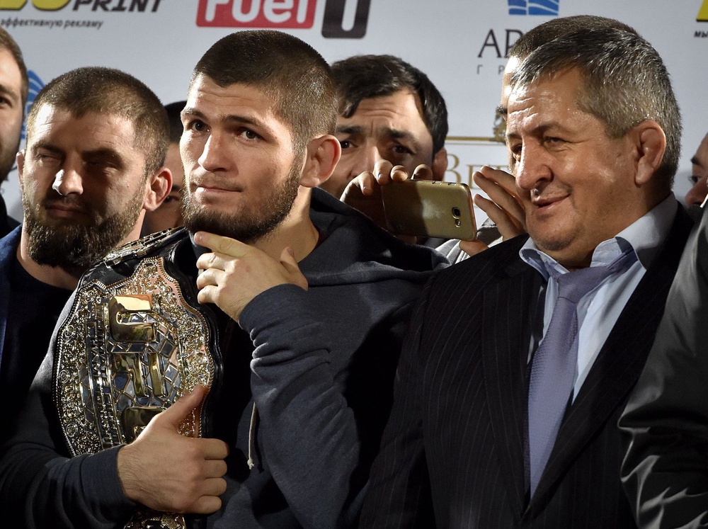 Nurmagomedov with his father Abdulmanap (right), who coached him from when he was a young boy (AFP/Getty)