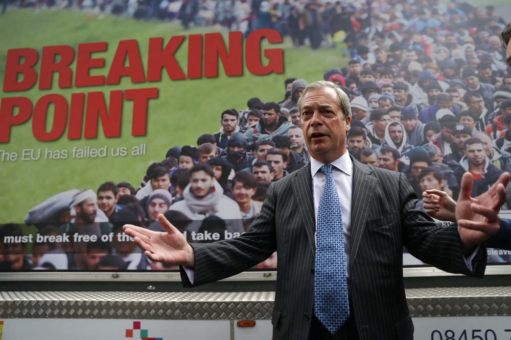 An anti-migrant poster unveiled by Nigel Farage was reported to the police in 2016 with a complaint that it incites racial hatred and breaches UK race laws (AFP/Getty)