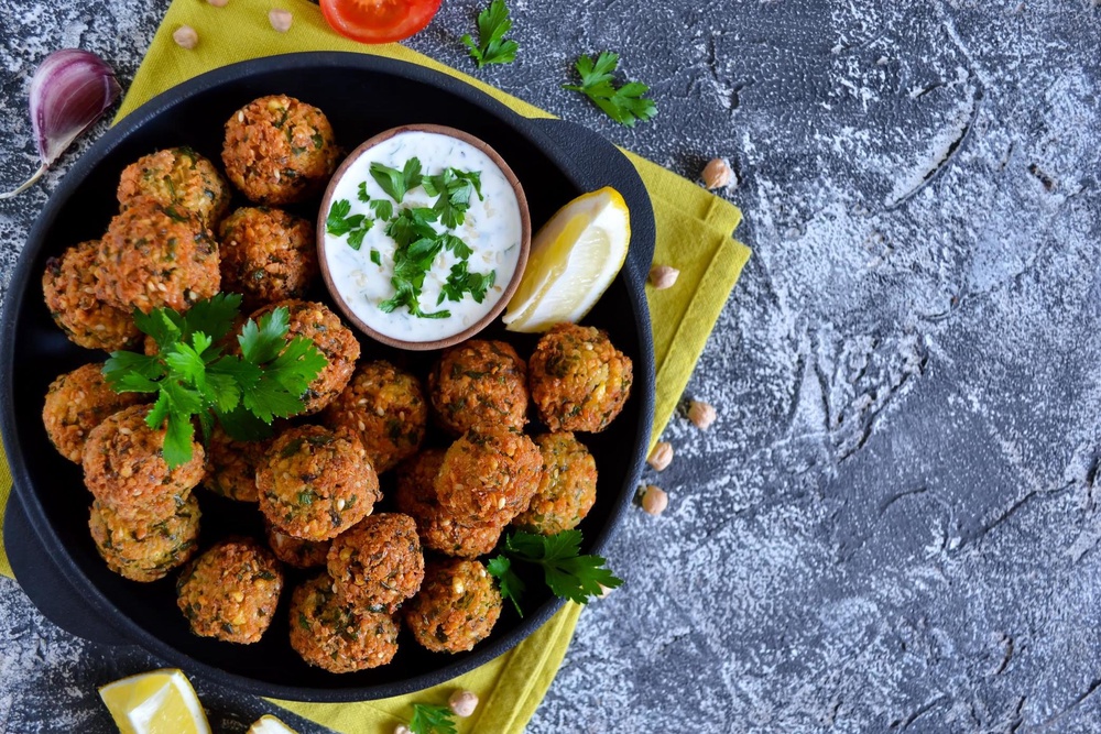 Falafel is usually made from chickpeas and can also count towards the one portion of beans and pulses (Getty/iStock)