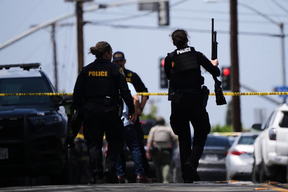 Image from: San Diego mosque shooting latest: Nazi symbol found at scene after three killed in suspected hate crime