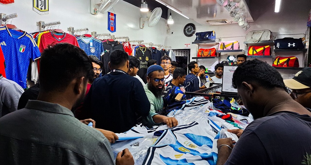 People buying football shirts in Dhaka
