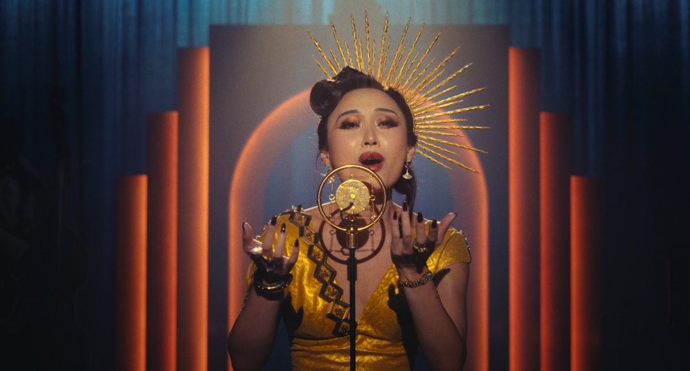 Li brings classic noir glamour to Cat, a nightclub singer with secrets of her own. – ALL HANDOUT PICS