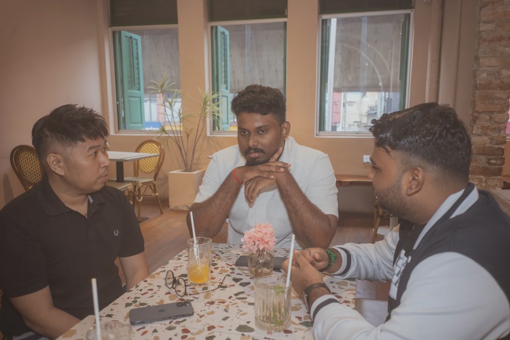 Kalii’s (centre) role as host is to make sure participants do not feel left out.