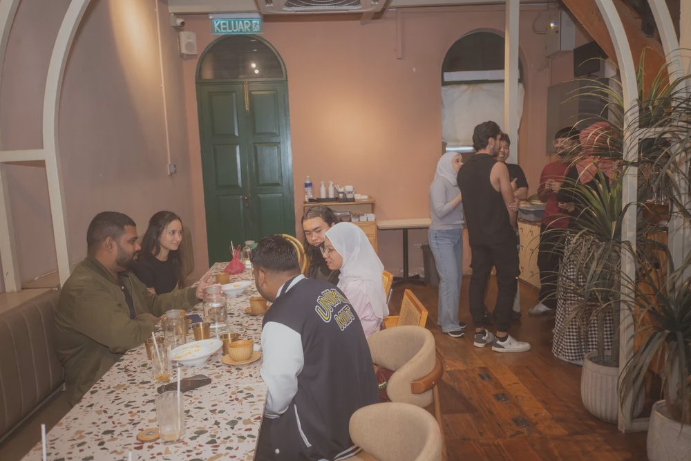 Participants use games and prompts to practise speaking English in a relaxed setting.