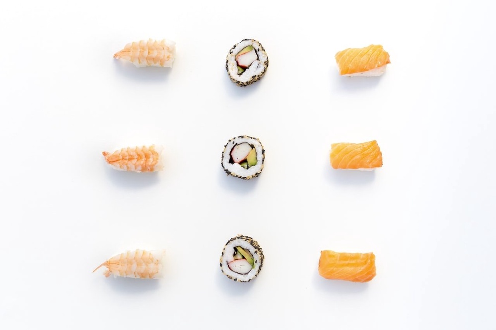 An assortment of sushi showing a wide variety of pieces