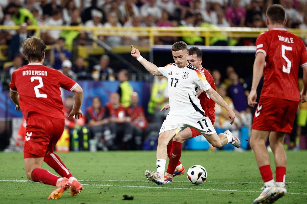 Germany weather storm at Euro 2024, holders Italy knocked out