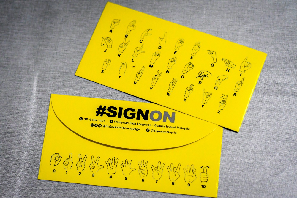 The design on the packets features hand symbols for the letters A to Z as well as numbers one to 10, which is two basic components, and the first step towards communicating in sign language. — Bernama pic
